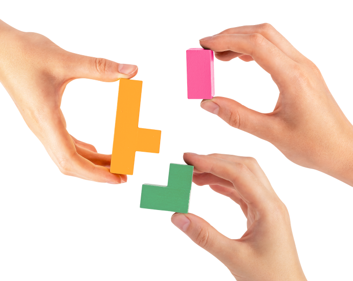 Hands joining blocks together representing community