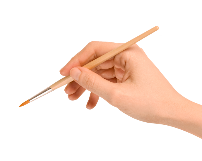 Hand with a paint brush representing creative media